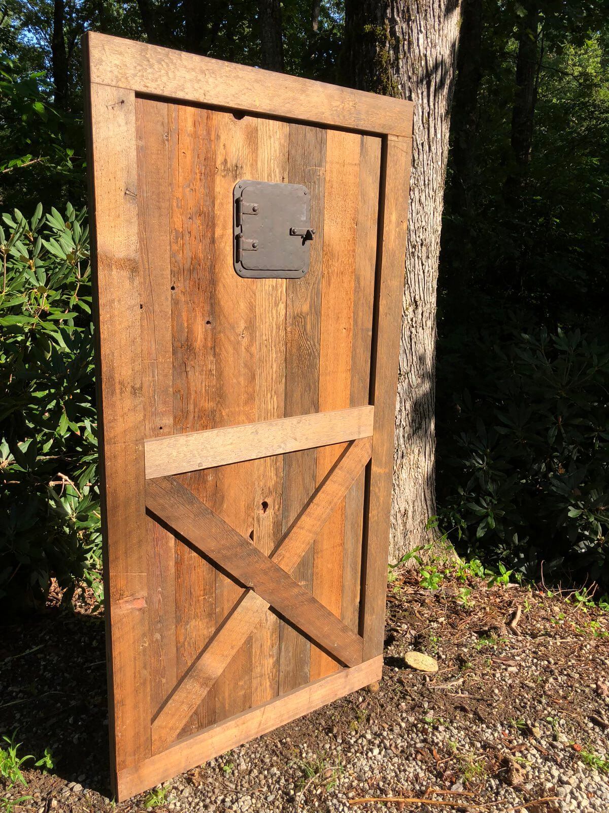 Rustic Georgia Pine Barn Door Grasse in production photo set outside