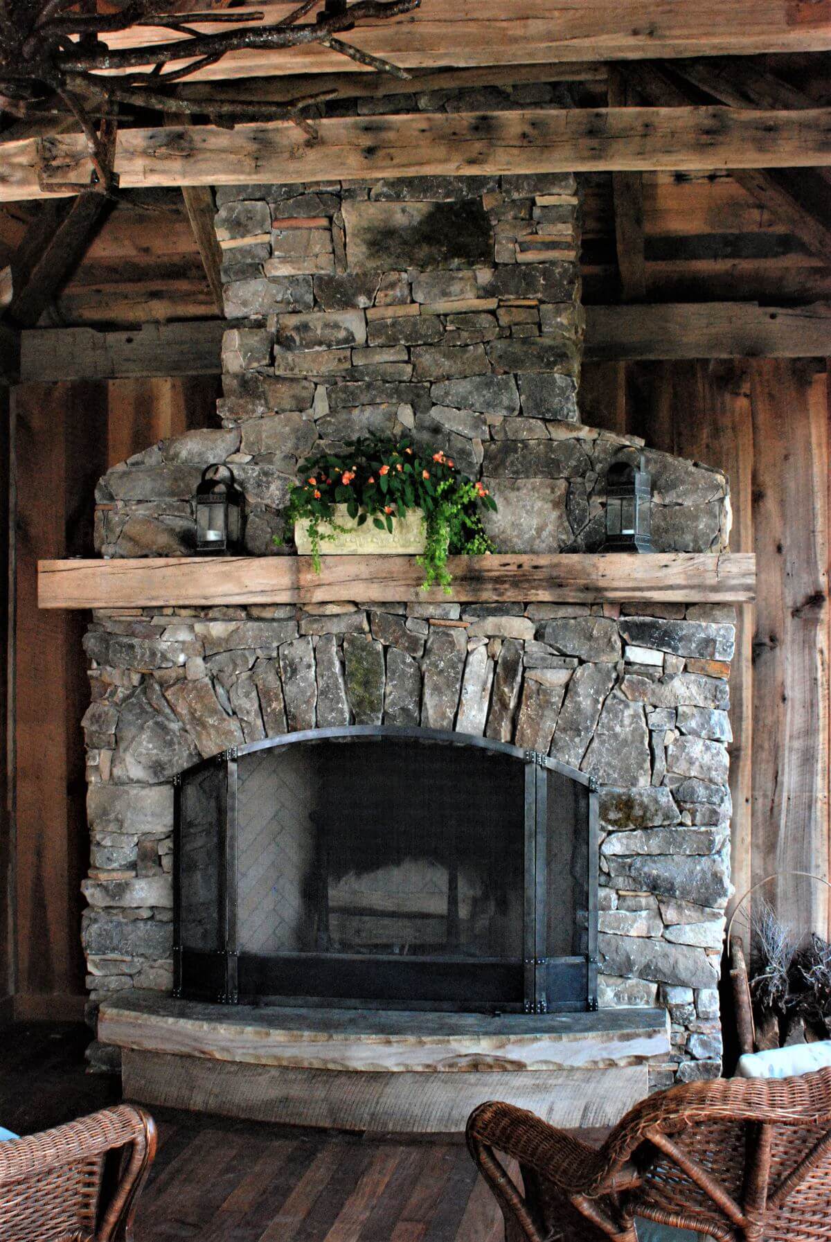 old wood mantel over an outdoor fireplace in hendersonville nc