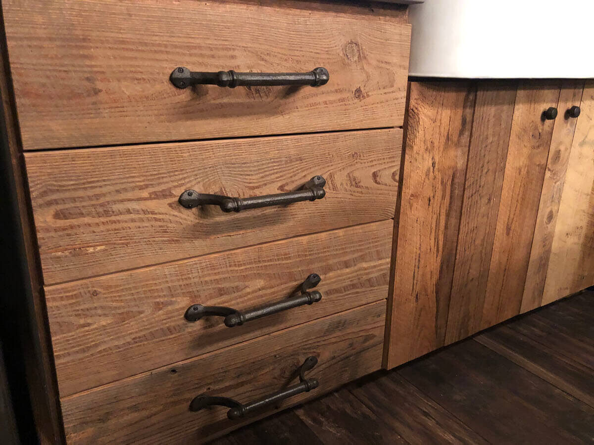 Reclaimed pine for cabinet construction.