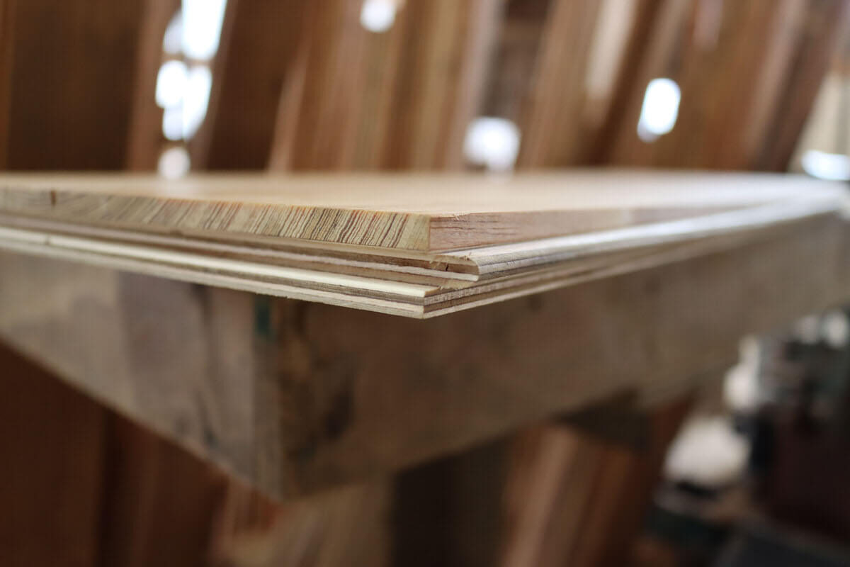 Reclaimed engineered floor board up close.
