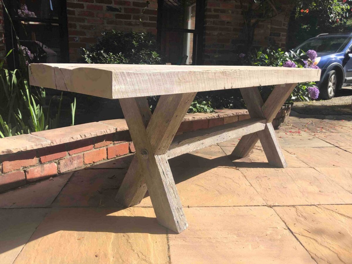 Reclaimed light wood table top outside.