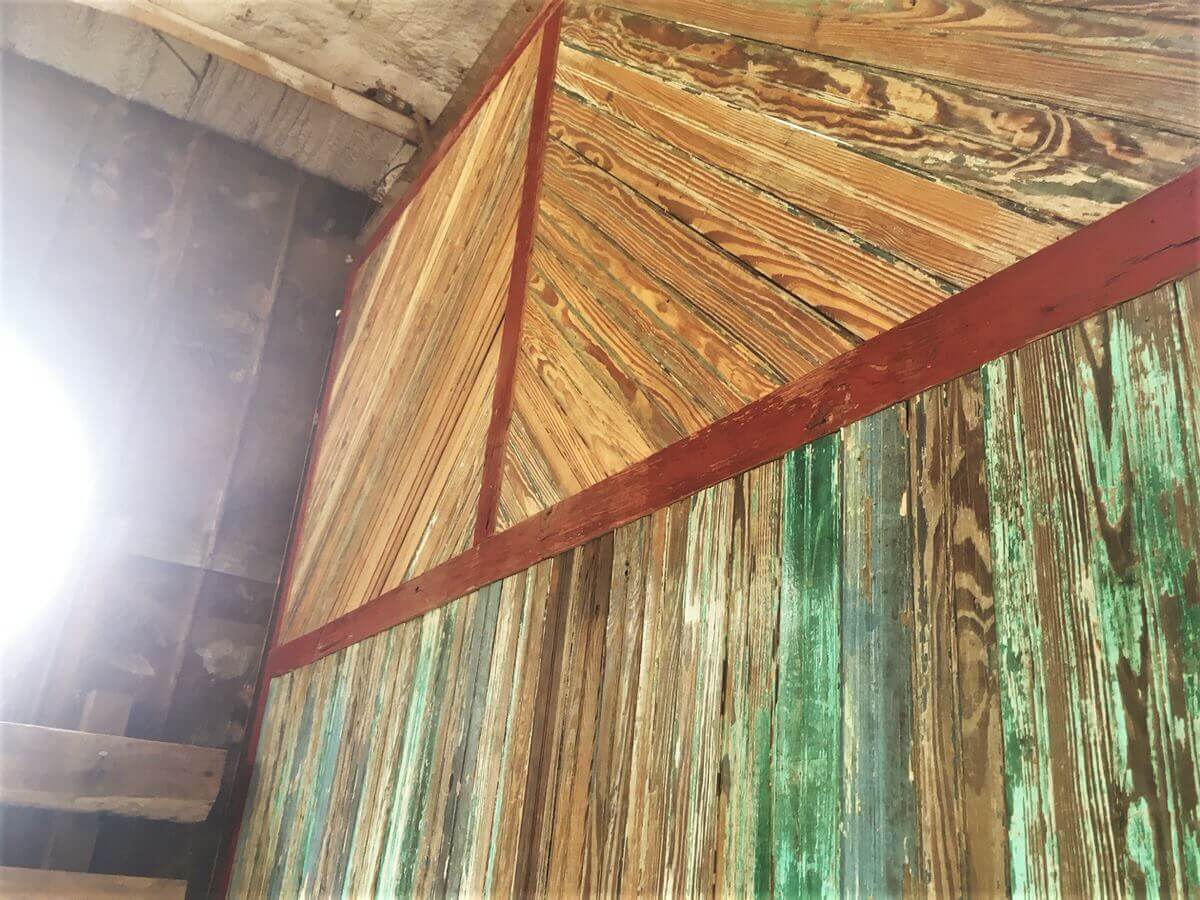 painted bead board accent wall and wire brushed unpainted upper wall