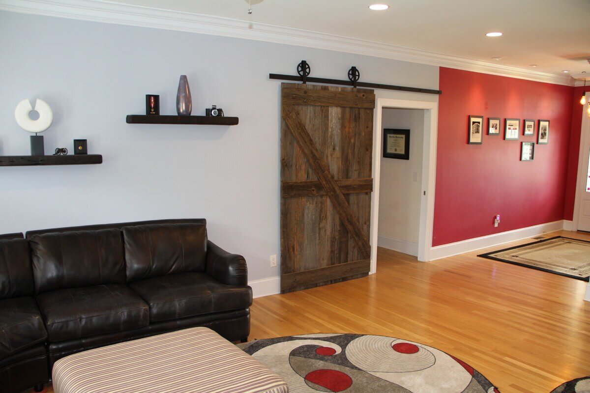 original surface georgia pine sliding barn door and red wall