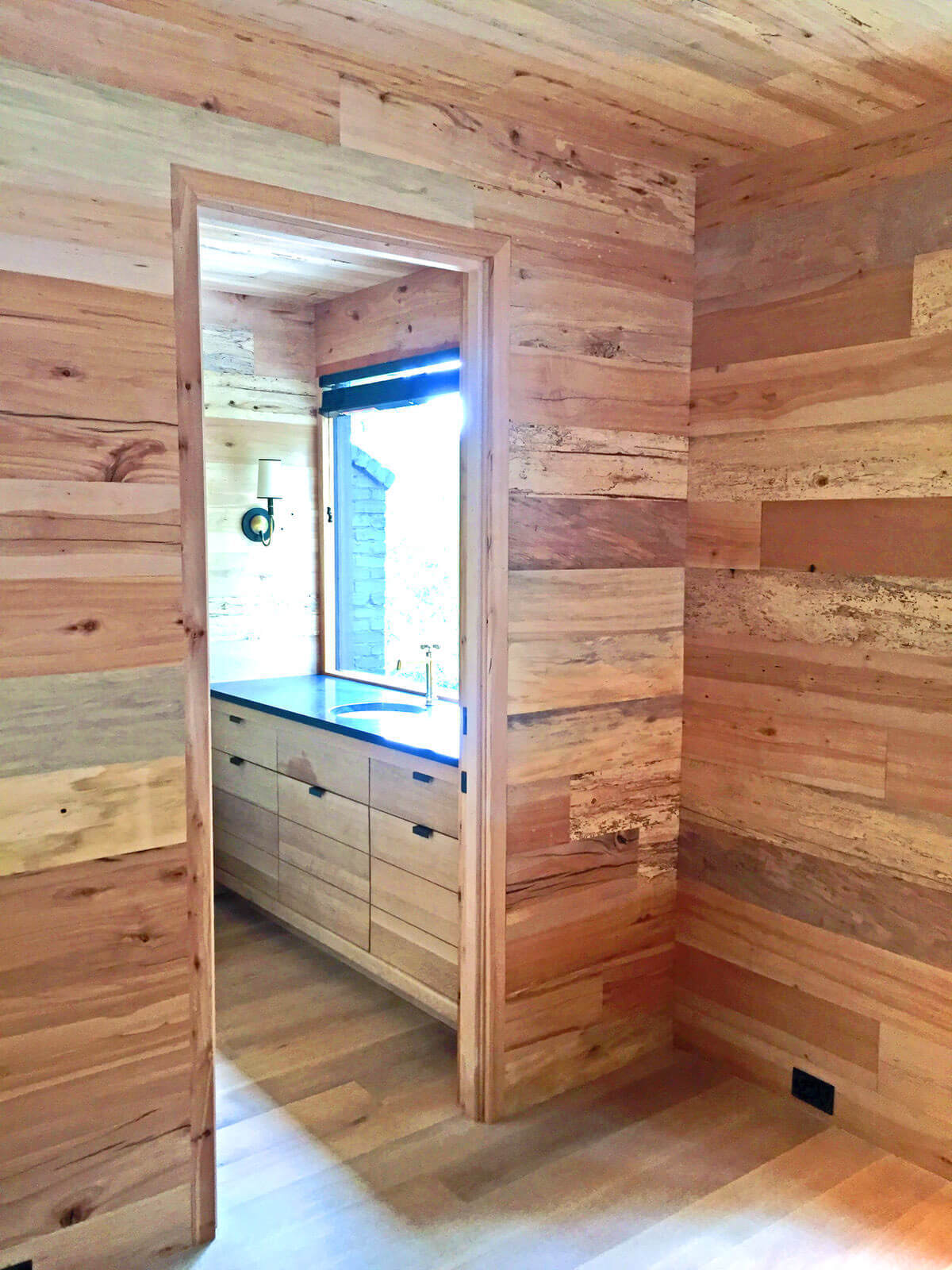 smooth hardwood paneling outside a bathroom
